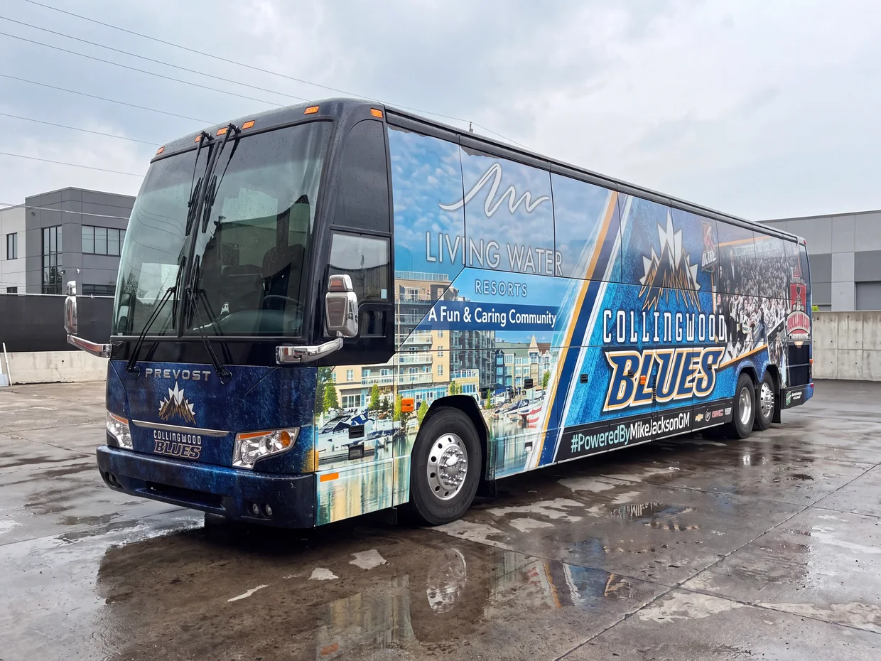 Prevost motorcoach in full Collingwood Blues livery, operated by Active Coach